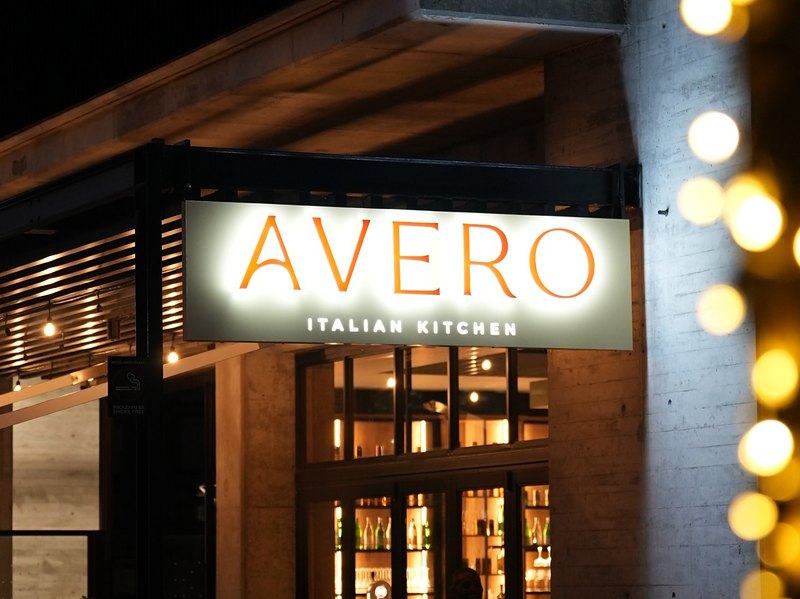 The Avero Italian Kitchen sign above the entrance and terrace on Gogosoa Street