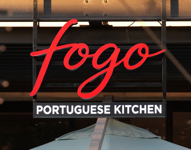 The red Fogo Portuguese Kitchen sign above the restaurant at Riverlands Mall