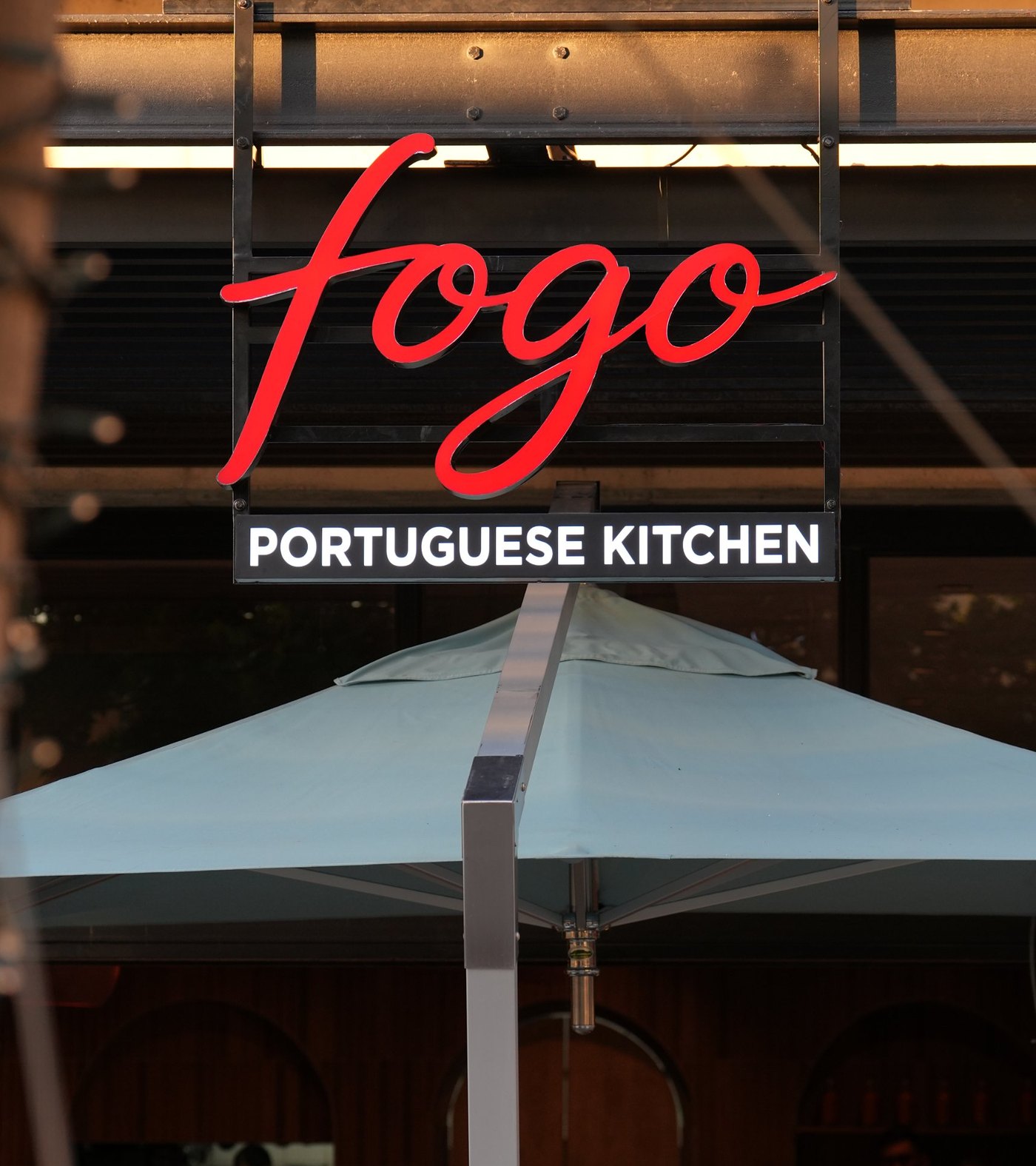 The red Fogo Portuguese Kitchen sign above the restaurant